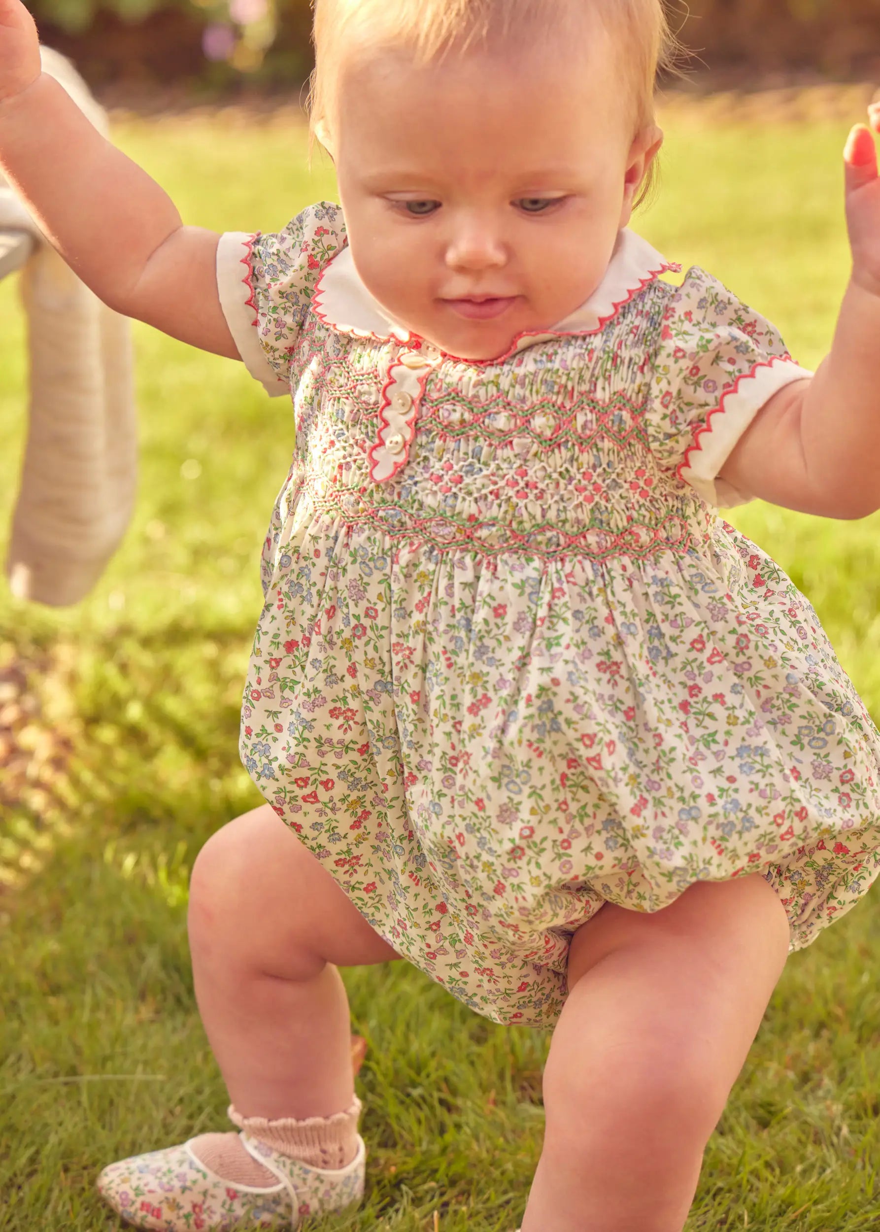 Cordelia Floral Hand-Smocked Short Sleeve Romper in Pink Made with Liberty Fabric (3m-2yrs) ROMPERS from Pepa London