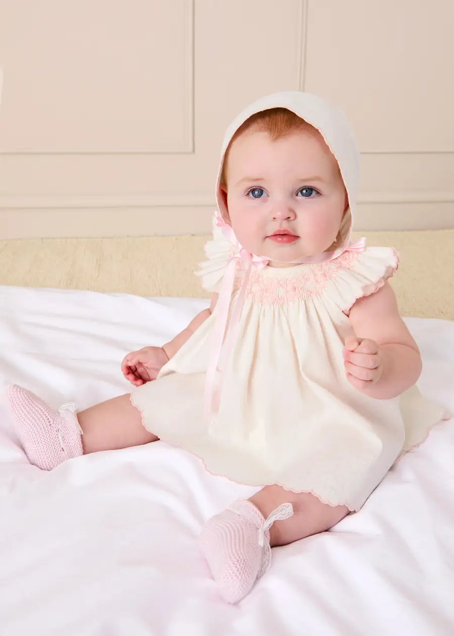 Pepa London Linen Blend Hand Smocked Cap Sleeve Dress With Bloomers in White (1-6mths) Luxury Childrenswear Pepa London Linen Blend Hand Smocked Cap Sleeve Dress With Bloomers in White (1-6mths) Luxury Childrenswear