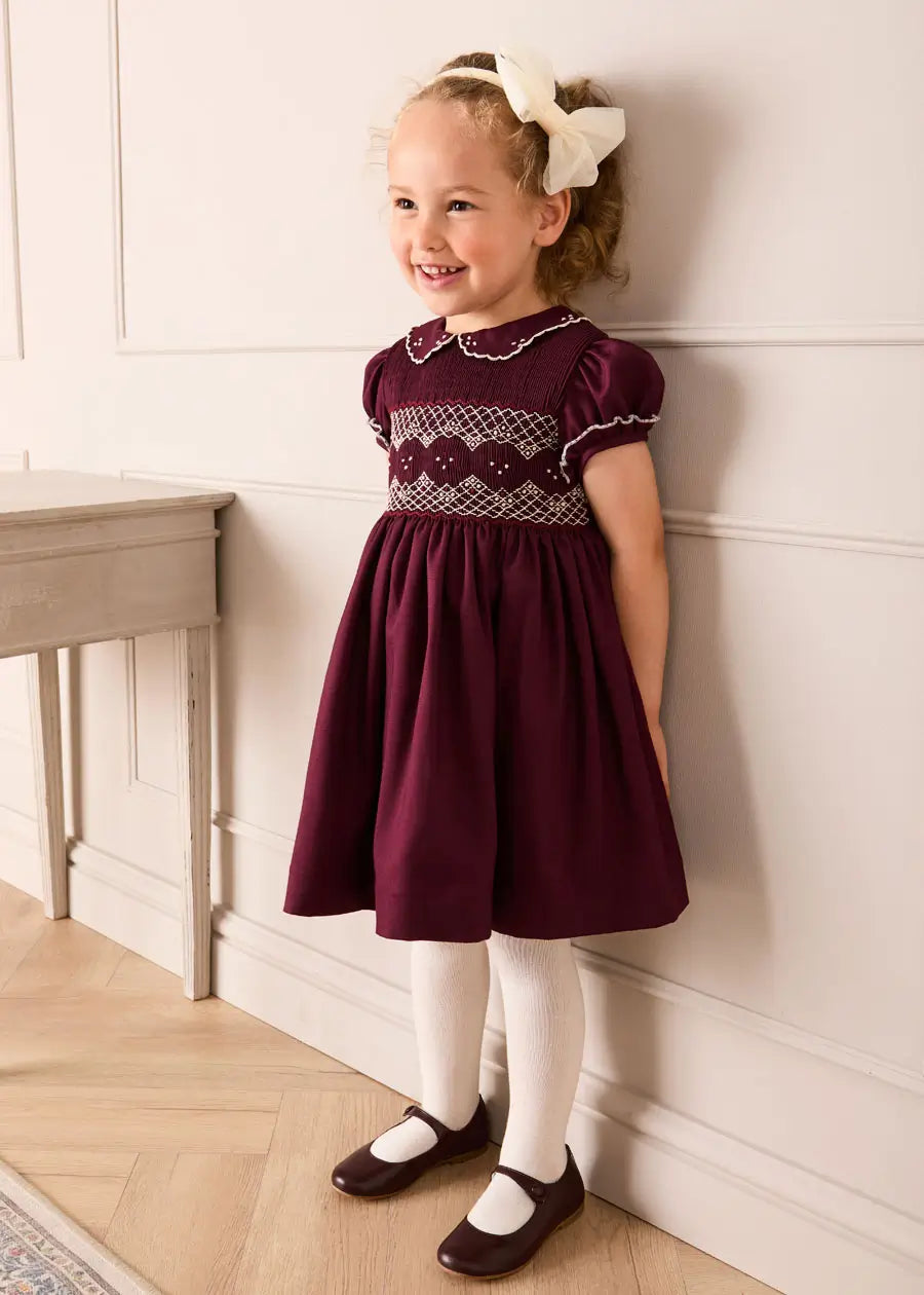 Hand Smocked Peter Pan Collar Short Sleeve Dress in Burgundy | Pepa London Hand Smocked Peter Pan Collar Short Sleeve Dress in Burgundy | Pepa London