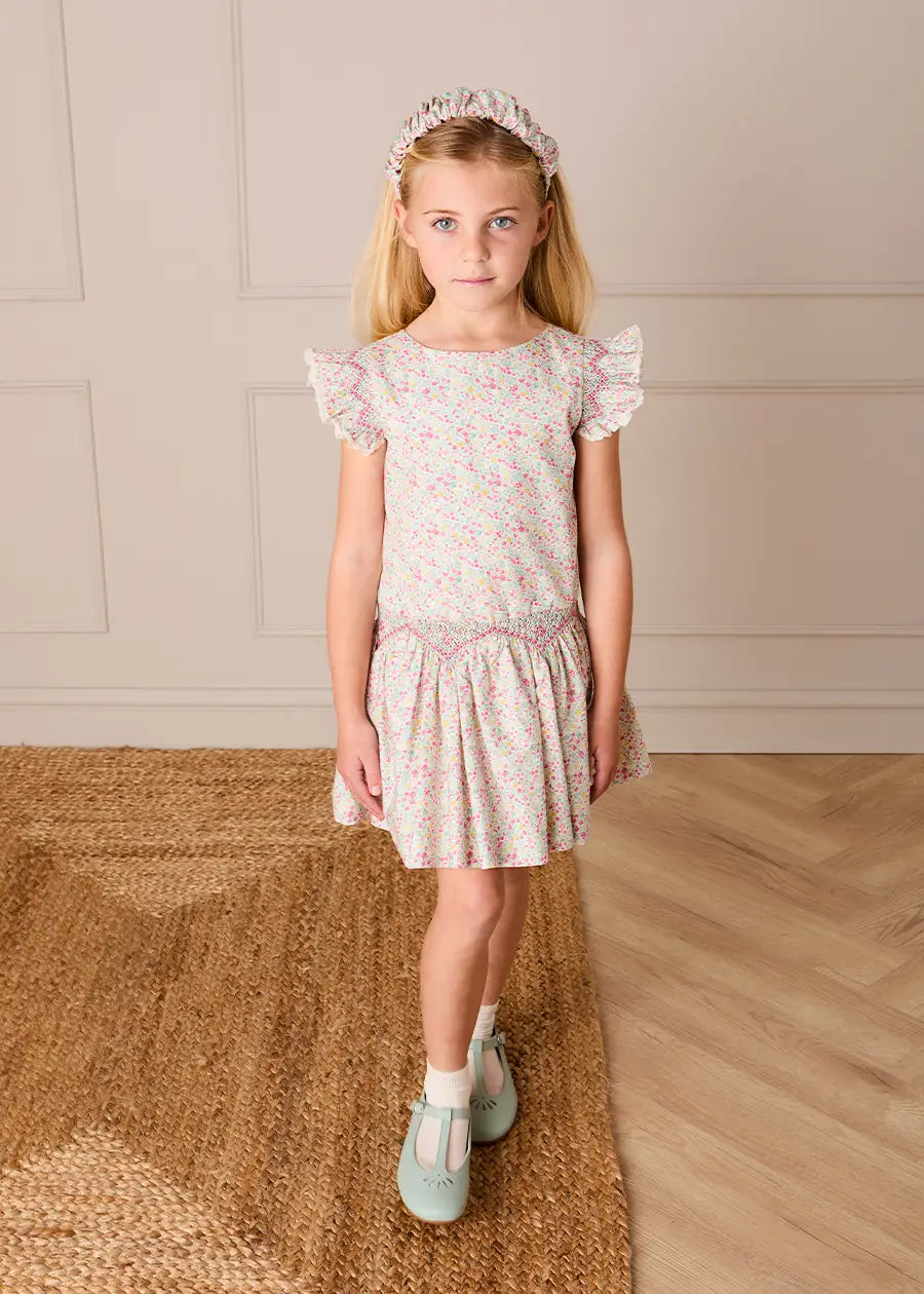 Pepa London Adelaide Floral Smocked Cap Sleeve Drop Waist Dress in Pink (4-12yrs) Luxury Childrenswear Pepa London Adelaide Floral Smocked Cap Sleeve Drop Waist Dress in Pink (4-12yrs) Luxury Childrenswear