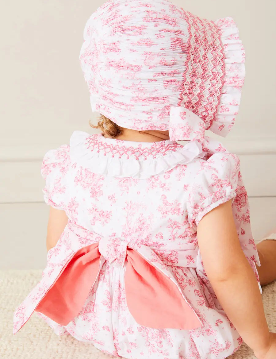 Audrey Toile Hand Smocked Bonnet in Pink (S-M) BONNETS from Pepa London