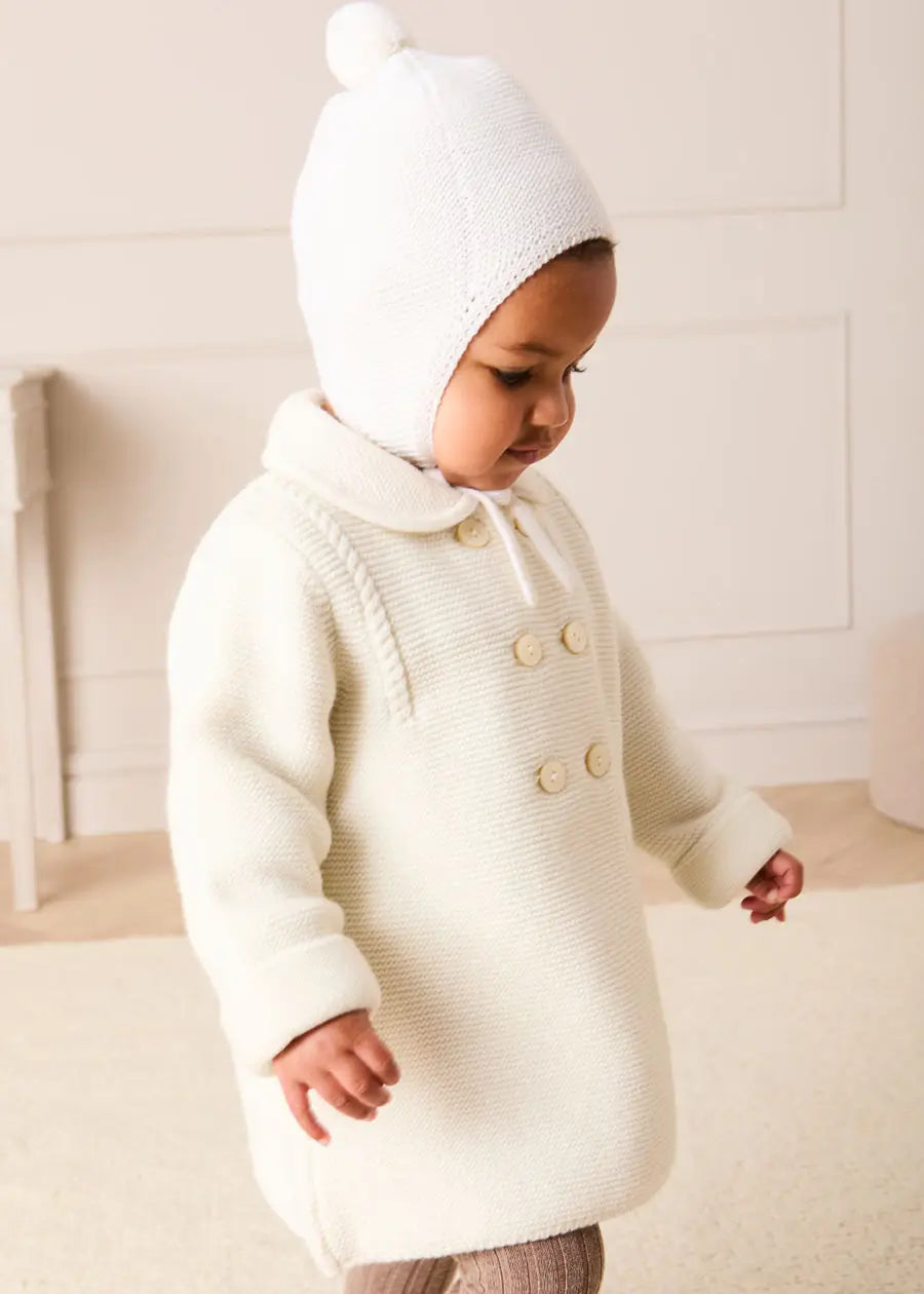 Merino Wool Pom Pom Hat in Cream (S-L) Knitted Accessories from Pepa London