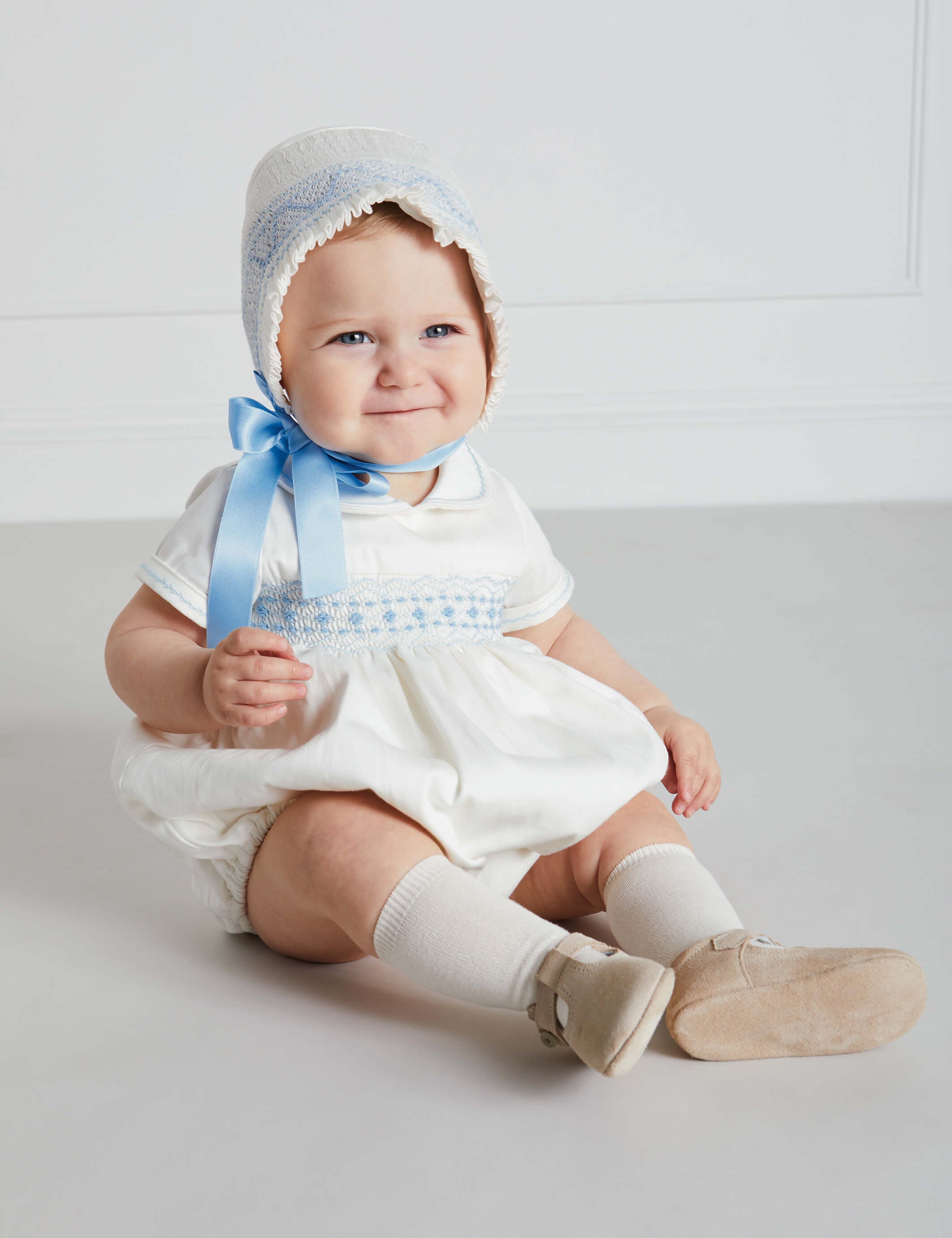 Classic Off-White Blue Hand Smocked Romper (3-18mths) Rompers from Pepa London