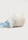 Off White and Blue Handsmocked Baby Bonnet Knitted Accessories  from Pepa London