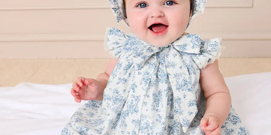 Audrey Toile Capped Sleeve Hand Smocked Dress with Bloomers in Blue (3-12mths) Dresses from Pepa London