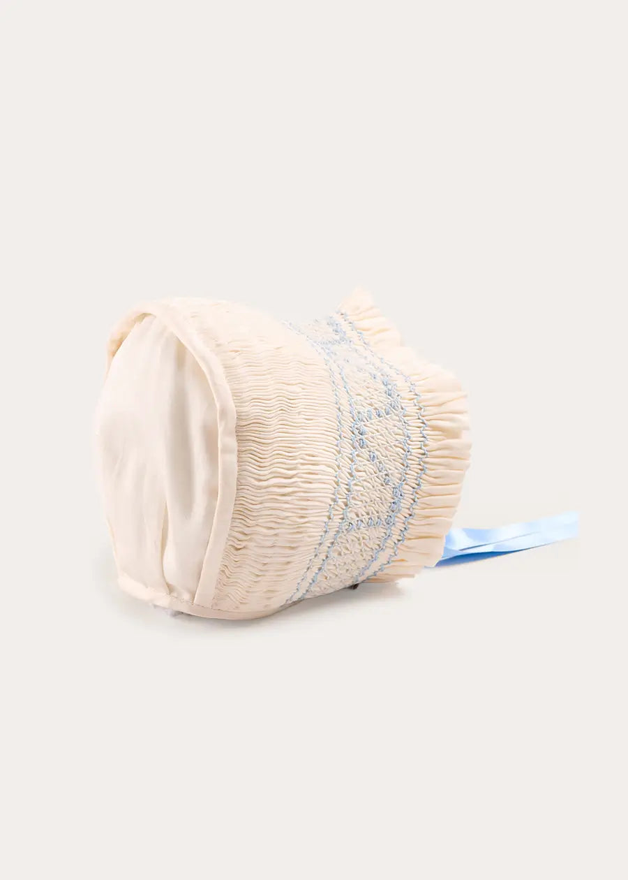 Off White and Blue Hand Smocked Baby Bonnet BONNETS from Pepa London