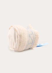 Off White and Blue Hand Smocked Baby Bonnet BONNETS from Pepa London