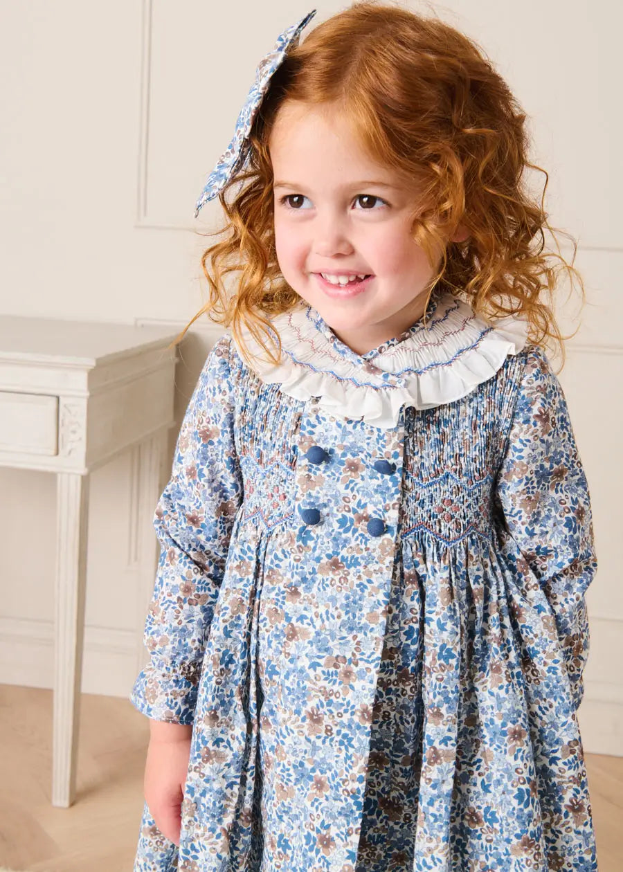 Beatrice Floral Hand Smocked Double Breasted Long Sleeve Dress in Blue (18mths-10yrs) Dresses from Pepa London