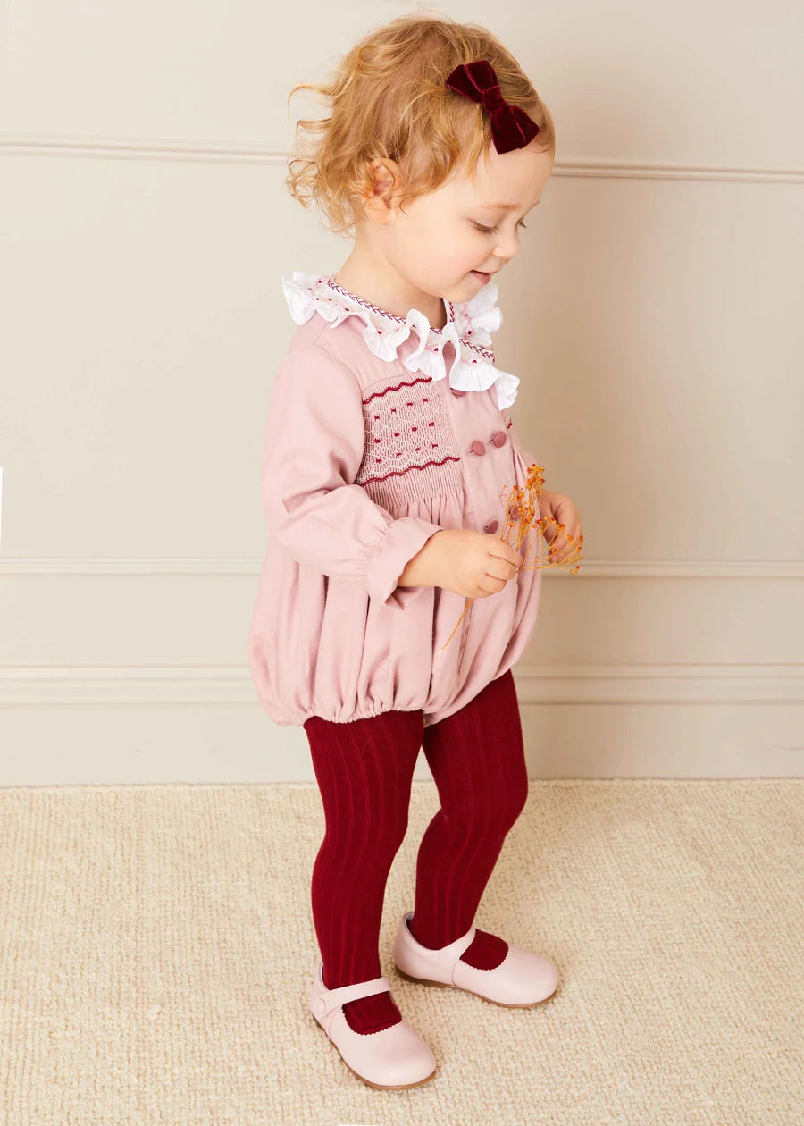 Hand Smocked Double Breasted Long Sleeve Romper in Pink | Pepa London Hand Smocked Double Breasted Long Sleeve Romper in Pink | Pepa London
