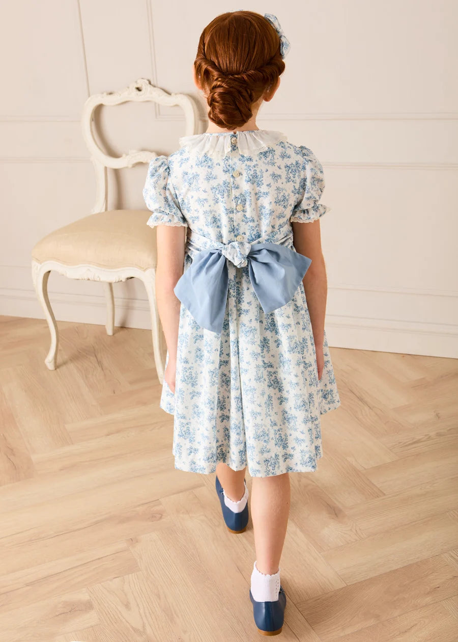 Audrey Toile Hand Smocked Ruffle Collar Short Sleeve Dress in Blue (12mths- 10yrs) Dresses from Pepa London
