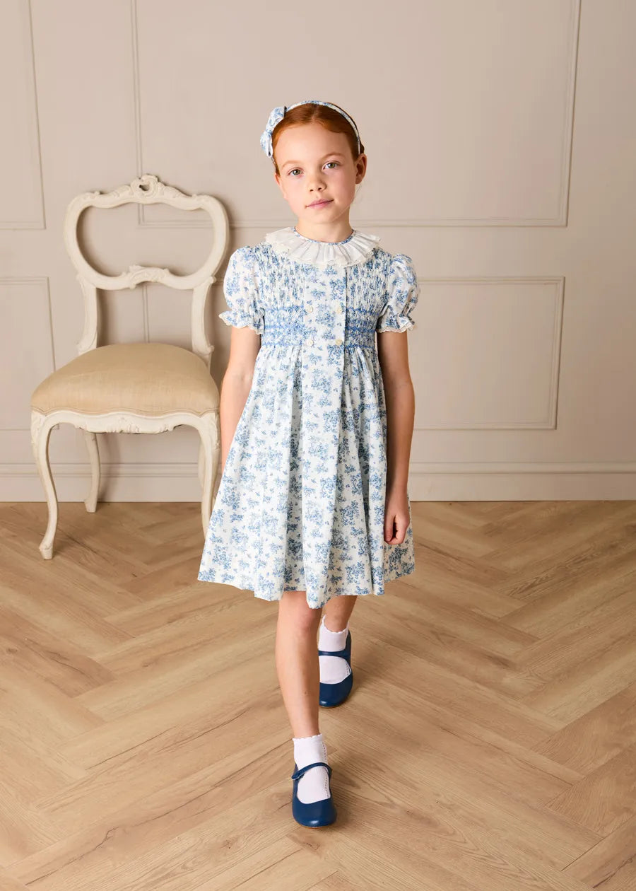 Audrey Toile Hand Smocked Short Sleeve Dress in Blue | Pepa London Audrey Toile Hand Smocked Short Sleeve Dress in Blue | Pepa London
