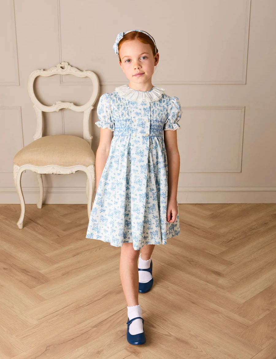 Audrey Toile Hand Smocked Ruffle Collar Short Sleeve Dress in Blue (12mths- 10yrs) Dresses from Pepa London