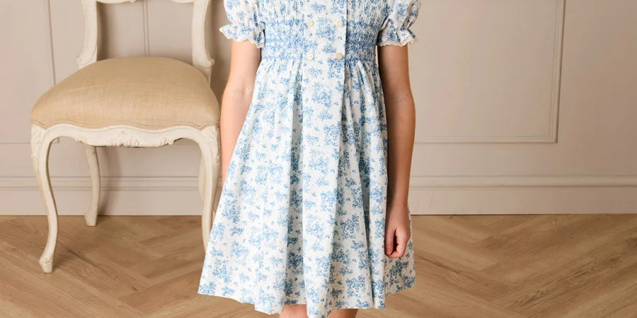 Audrey Toile Hand Smocked Ruffle Collar Short Sleeve Dress in Blue (12mths- 10yrs) Dresses from Pepa London
