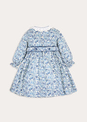 Daphne Floral Hand Smocked Frill Collar Long Sleeve Dress in Blue (18mths-10yrs) Dresses from Pepa London