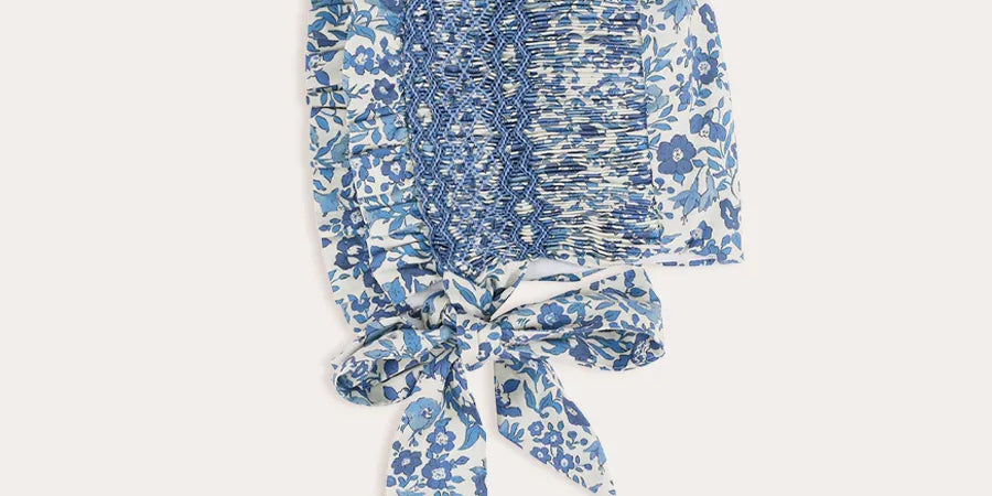 Daphne Floral Hand Smocked Bonnet in Blue (S-L) Knitted Accessories from Pepa London