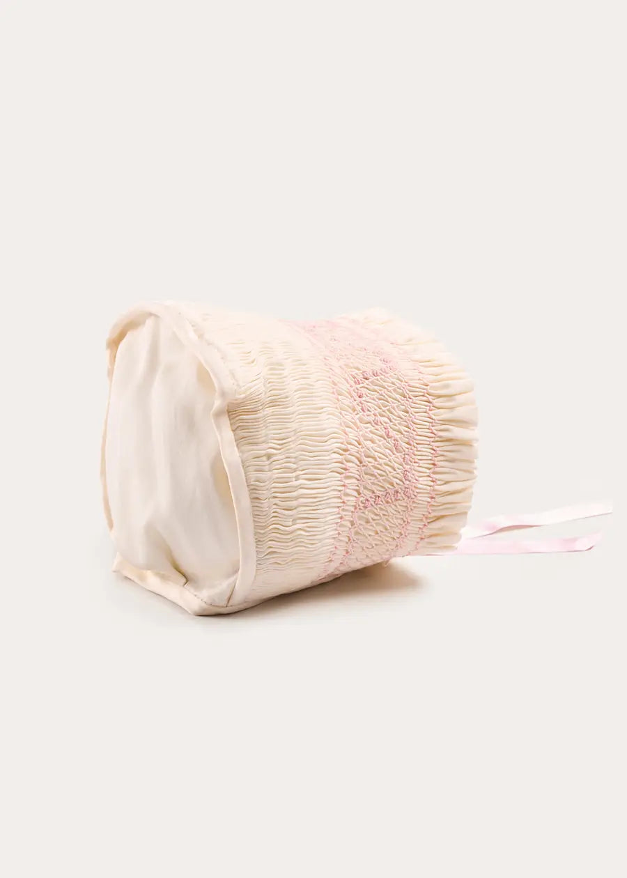 Off White and Pink Hand Smocked Baby Bonnet BONNETS from Pepa London