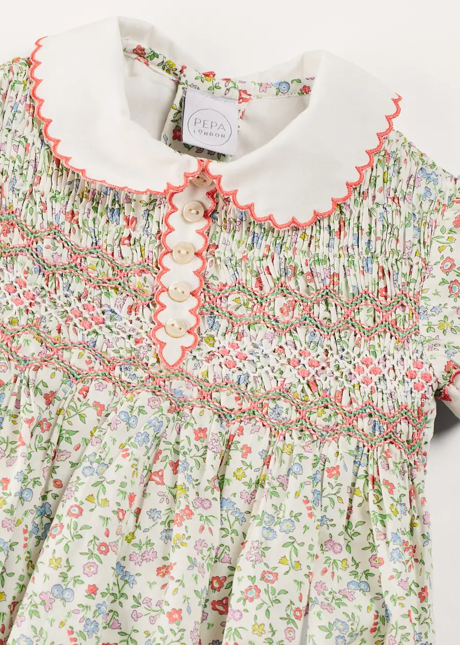 Cordelia Floral Hand-Smocked Short Sleeve Romper in Pink Made with Liberty Fabric (3m-2yrs) ROMPERS from Pepa London