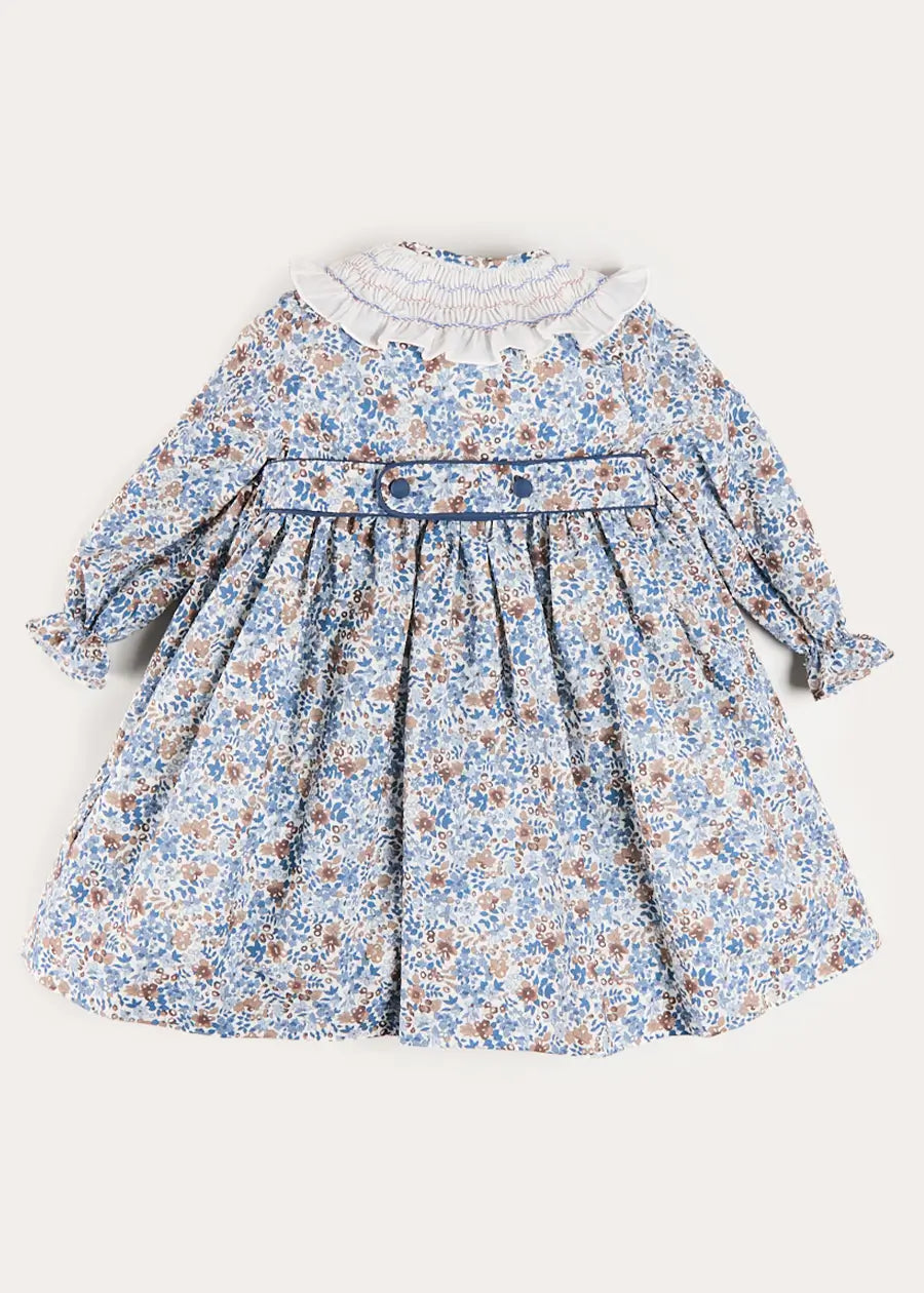 Beatrice Floral Hand Smocked Double Breasted Long Sleeve Dress in Blue (18mths-10yrs) Beatrice Floral Hand Smocked Double Breasted Long Sleeve Dress in Blue (18mths-10yrs)