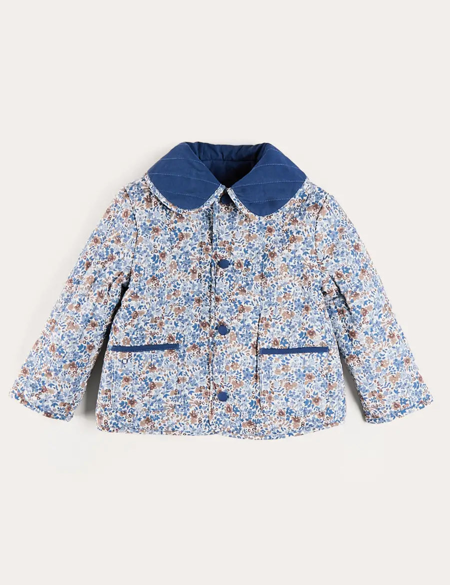 Beatrice Floral Reversible Quilted Jacket in Blue (3-10yrs) Coats from Pepa London