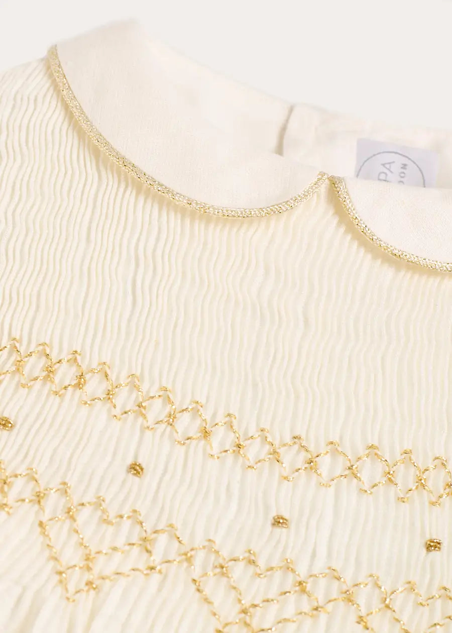 Hand Smocked Gold Embroidered Sleeveless Dress in Ivory | Pepa London Hand Smocked Gold Embroidered Sleeveless Dress in Ivory | Pepa London