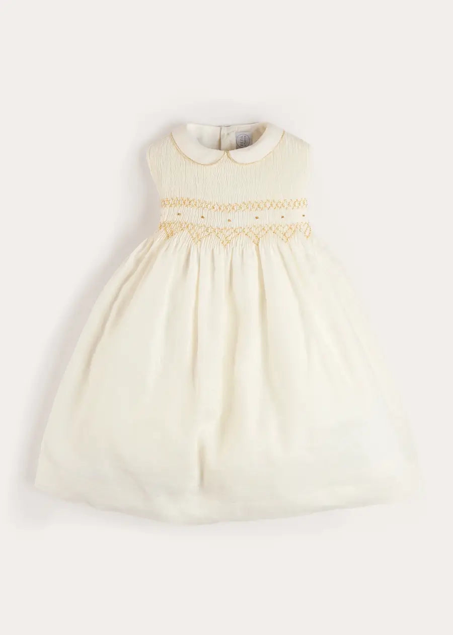 Pepa London Hand Smocked Gold Embroidered Sleeveless Dress in Ivory (12mths- 10yrs) Luxury Childrenswear Pepa London Hand Smocked Gold Embroidered Sleeveless Dress in Ivory (12mths- 10yrs) Luxury Childrenswear