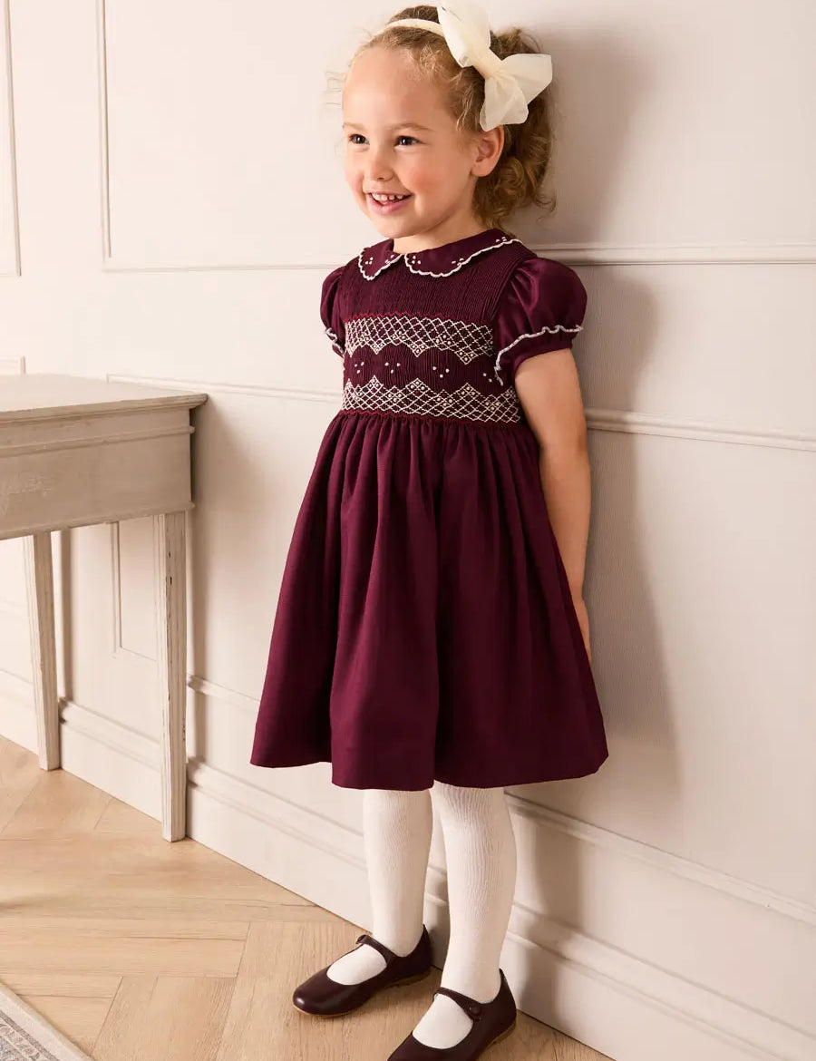 Hand Smocked Peter Pan Collar Short Sleeve Dress in Burgundy (12mths-10yrs) Dresses from Pepa London