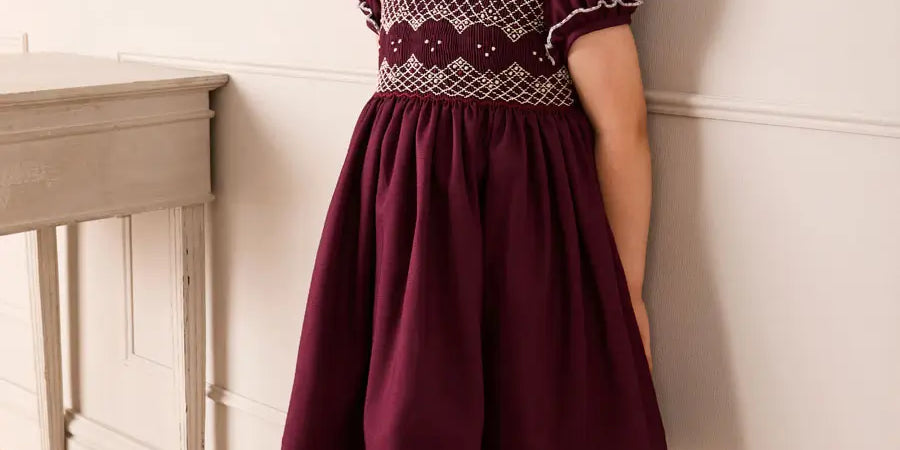 Hand Smocked Peter Pan Collar Short Sleeve Dress in Burgundy (12mths-10yrs) Dresses from Pepa London