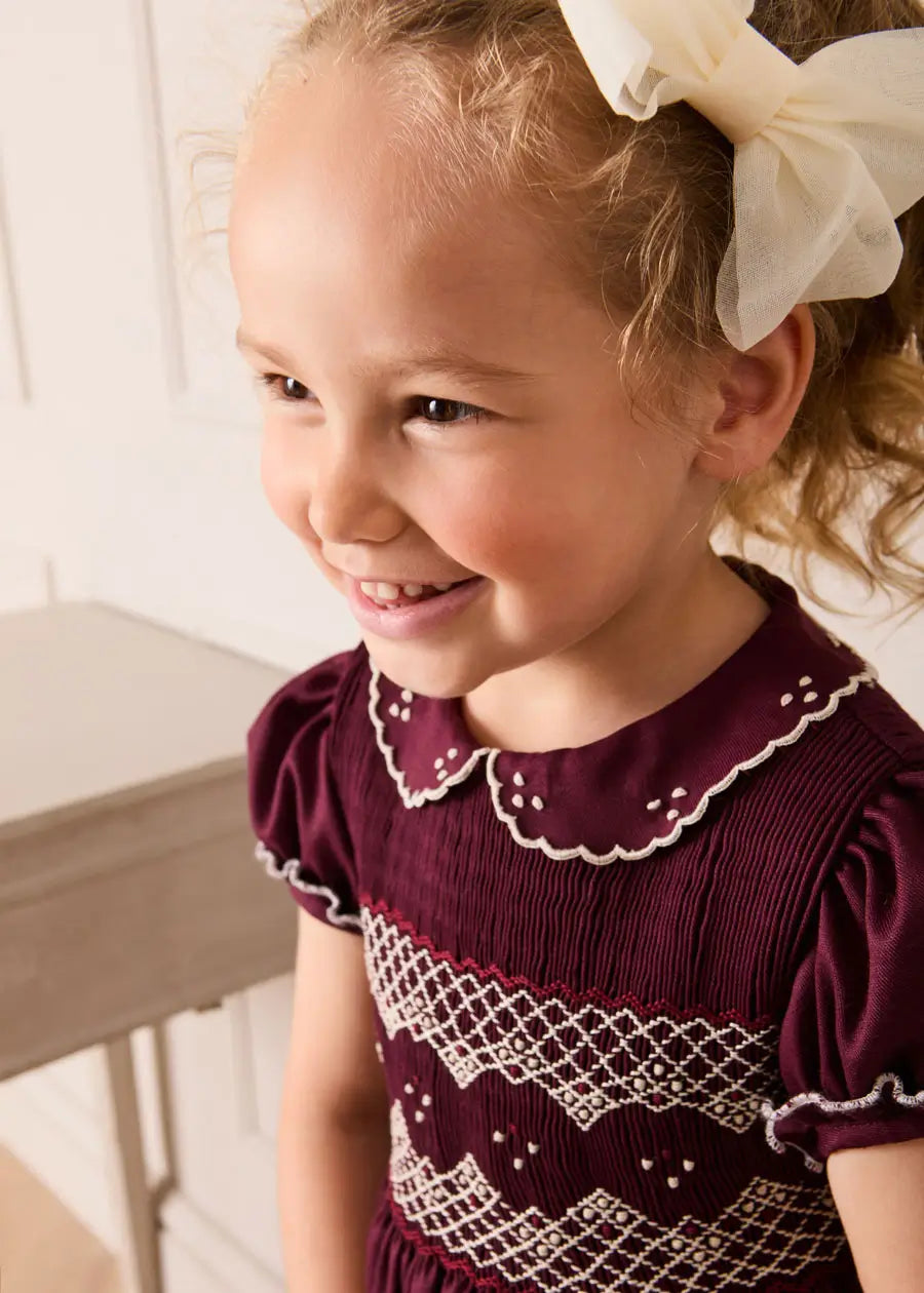 Hand Smocked Peter Pan Collar Short Sleeve Dress in Burgundy (12mths-10yrs) Dresses from Pepa London