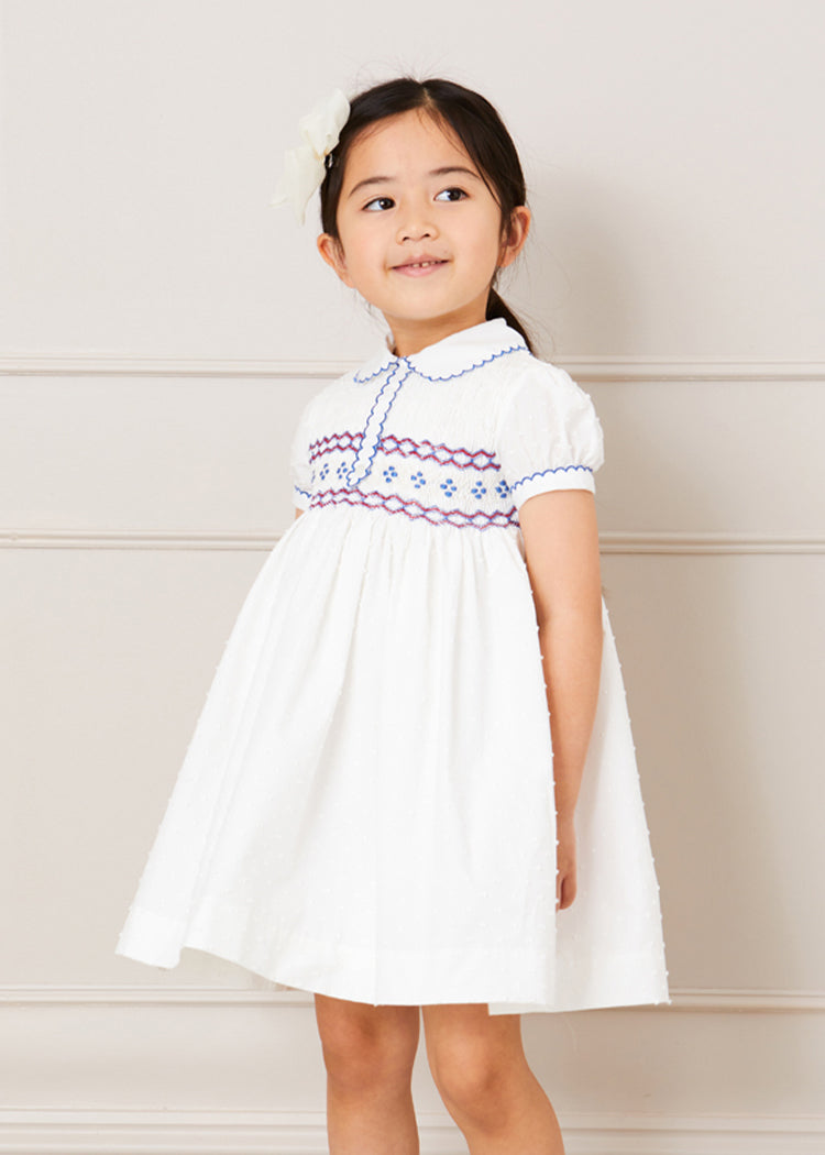 Hand Smocked Plumetti Short Sleeve Dress in White (12mths-6yrs) Dresses  from Pepa London