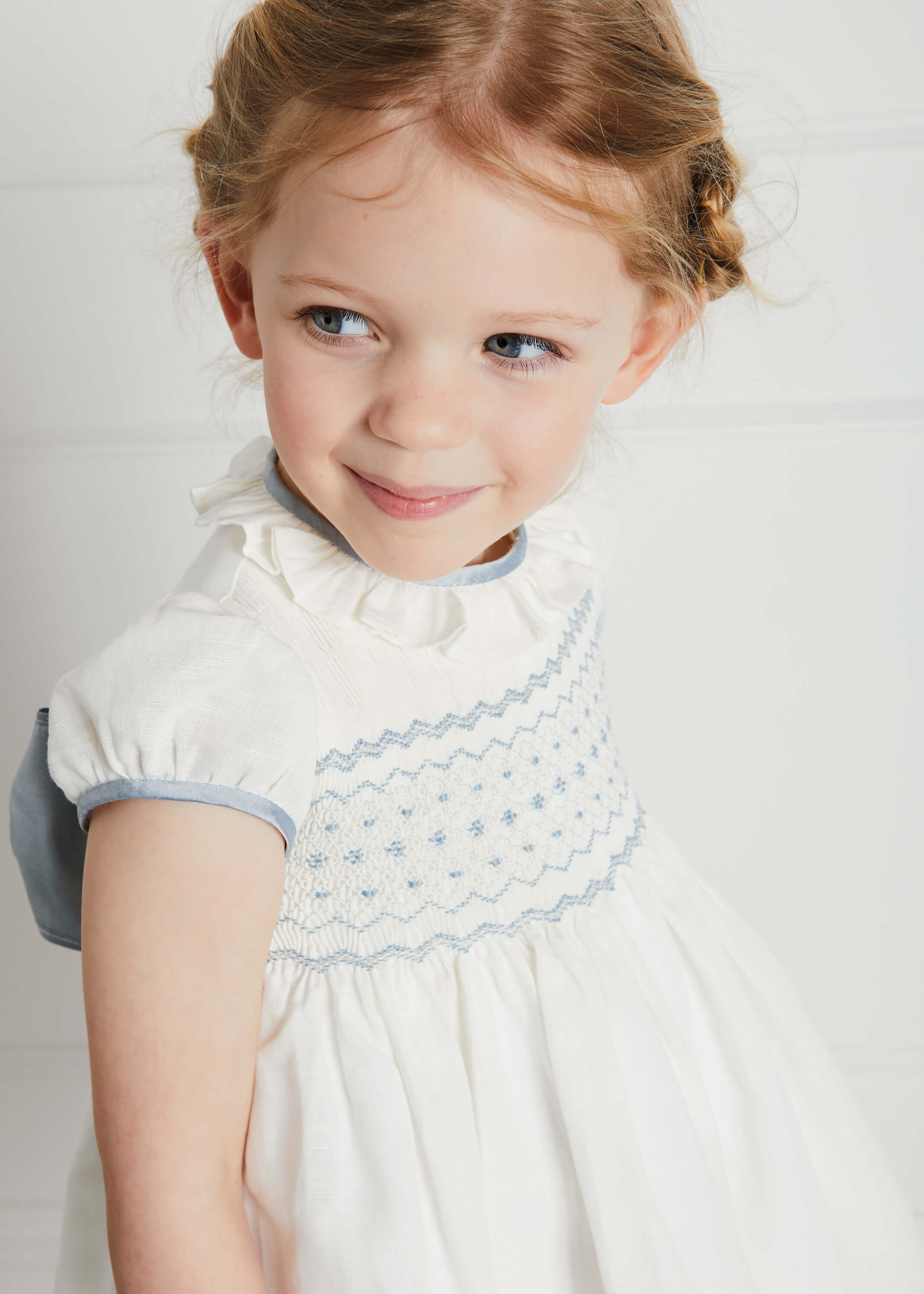 Ivory Hand Smocked Occasion Dress with Blue Details (6mths-8yrs) Dresses from Pepa London