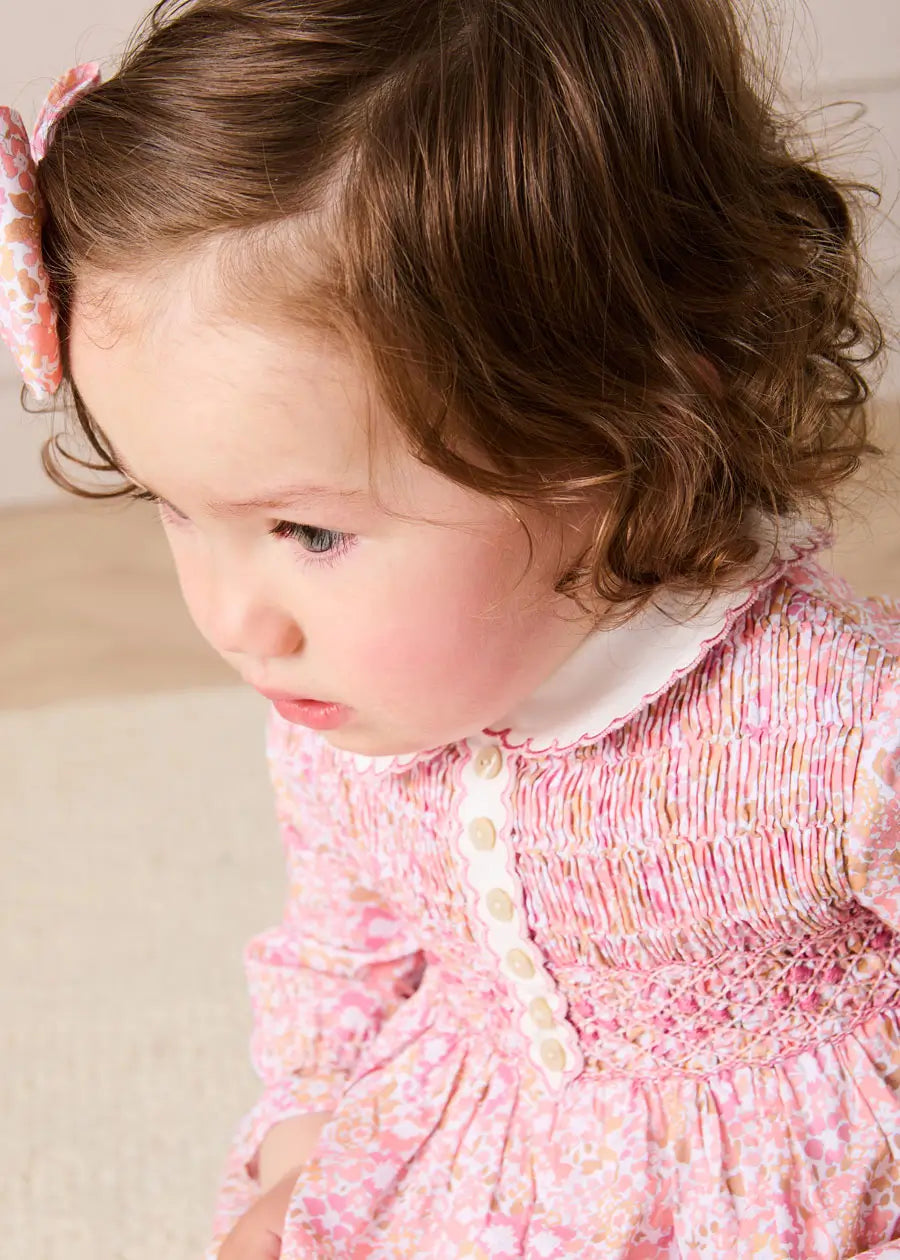 Nellie Floral Hand Smocked Long Sleeve Romper in Pink (6mths-2yrs) Rompers from Pepa London