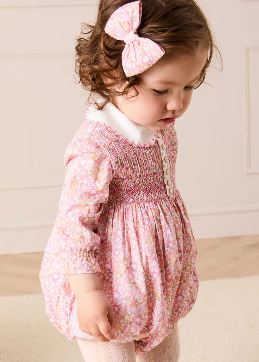 Nellie Floral Hand Smocked Long Sleeve Romper in Pink (6mths-2yrs) Rompers from Pepa London