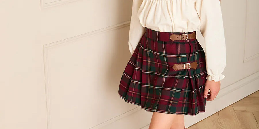 Balmoral Tartan Buckle Detail Pleated Skirt in Burgundy (3-10yrs) Skirts from Pepa London