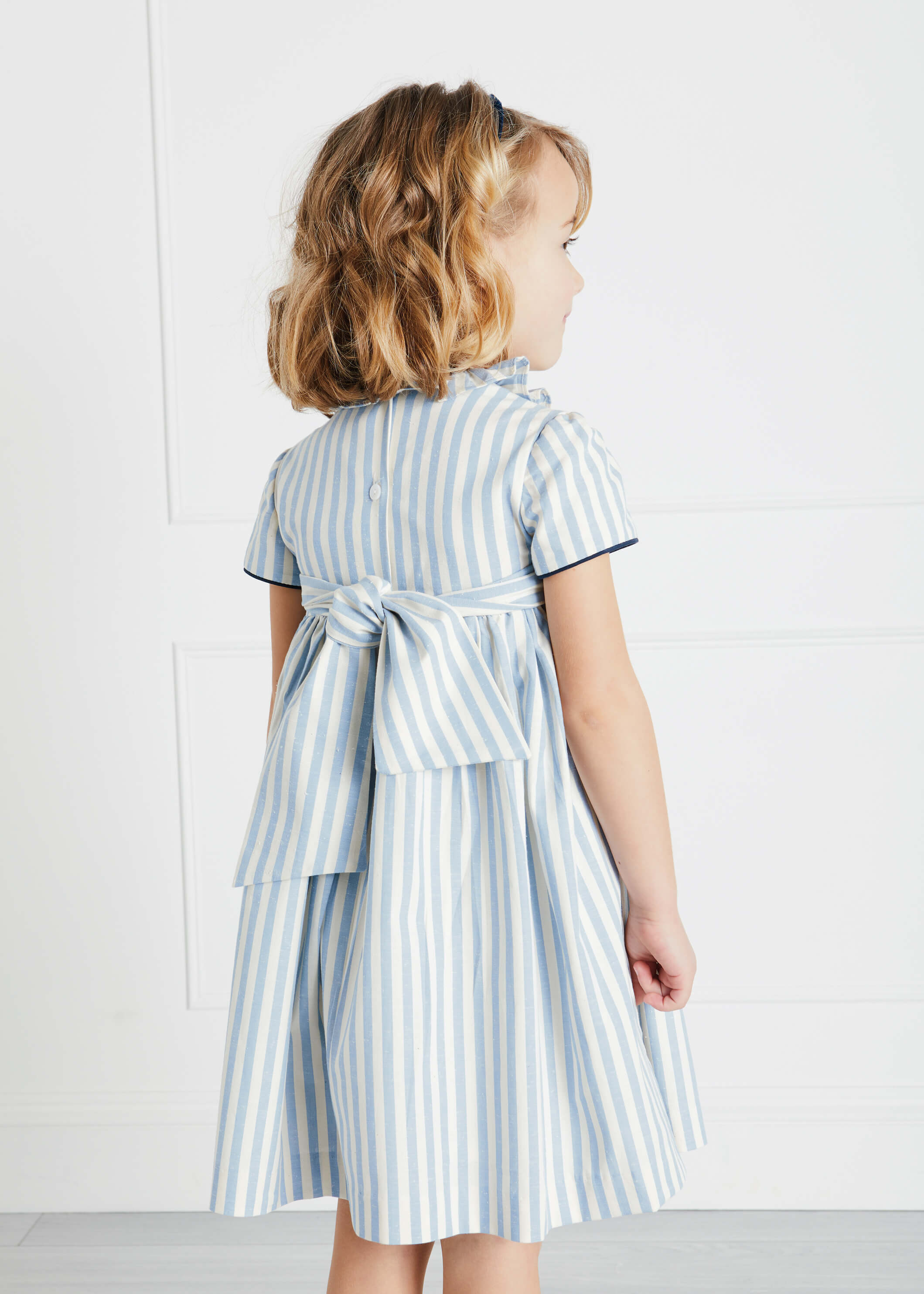 Hand Smocked Delicate Stripe Short Sleeve Dress in Blue (12mths-10yrs) Dresses  from Pepa London