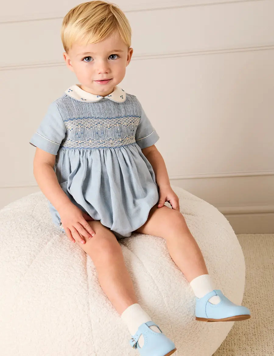 Hand Smocked Peter Pan Collar Short Sleeve Romper in Sky Blue (3mths-2yrs) Rompers from Pepa London