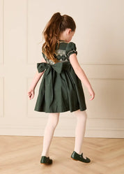 The Icon Hand Smocked Peter Pan Collar Short Sleeve Dress in Racing Green (18mths-10yrs) Dresses from Pepa London