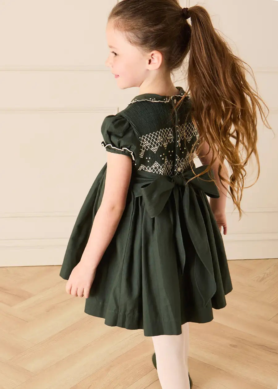 The Icon Hand Smocked Peter Pan Collar Short Sleeve Dress in Racing Green (18mths-10yrs) Dresses from Pepa London