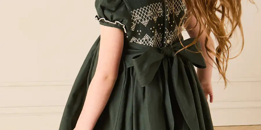 The Icon Hand Smocked Peter Pan Collar Short Sleeve Dress in Racing Green (18mths-10yrs) Dresses from Pepa London