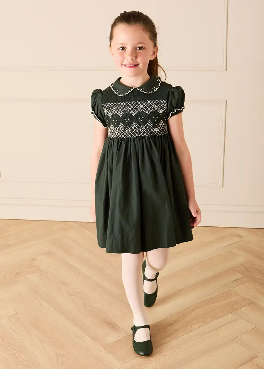 The Icon Hand Smocked Peter Pan Collar Short Sleeve Dress in Racing Green (18mths-10yrs) Dresses from Pepa London