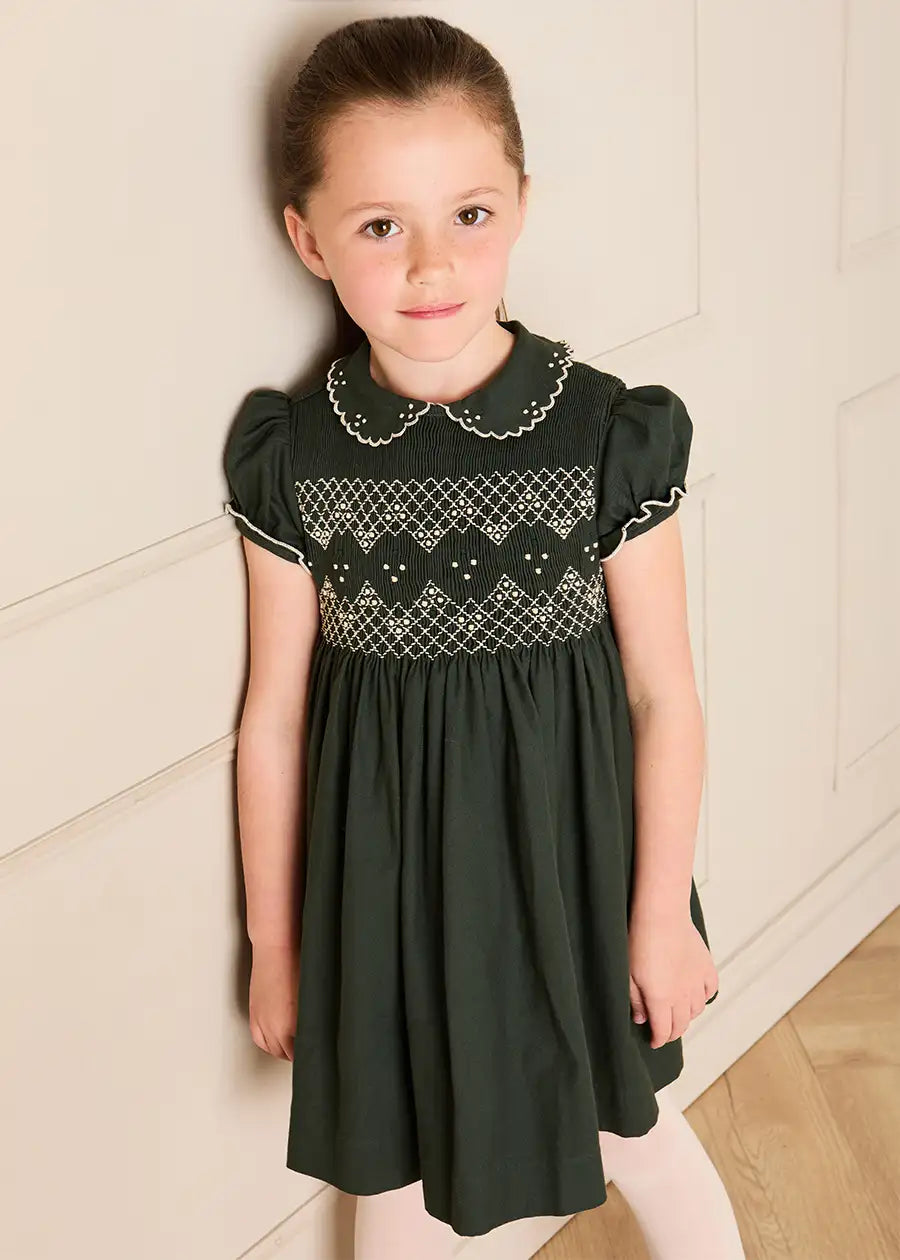 The Icon Hand Smocked Peter Pan Collar Short Sleeve Dress in Racing Green (18mths-10yrs) Dresses from Pepa London