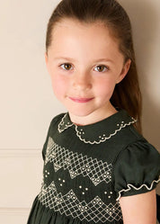 The Icon Hand Smocked Peter Pan Collar Short Sleeve Dress in Racing Green (18mths-10yrs) Dresses from Pepa London