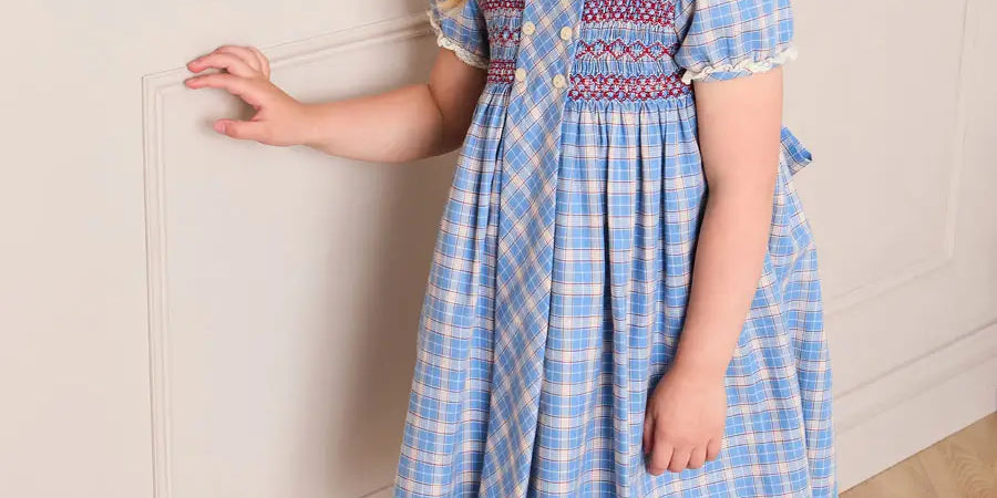 Denby Check Hand Smocked Double Breasted Short Sleeve Dress in Blue (12mths-10yrs) Dresses from Pepa London