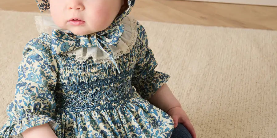 Daphne Floral Hand Smocked Long Sleeve Romper in Blue (6mths-3yrs) Rompers from Pepa London