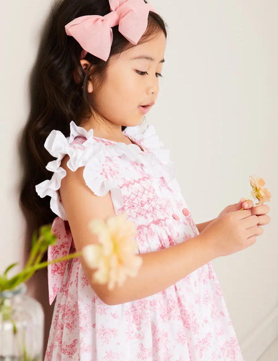 Audrey Toile Hand Smocked Double Breasted Sleeveless Dress in Pink (12mths-10yrs) DRESSES from Pepa London