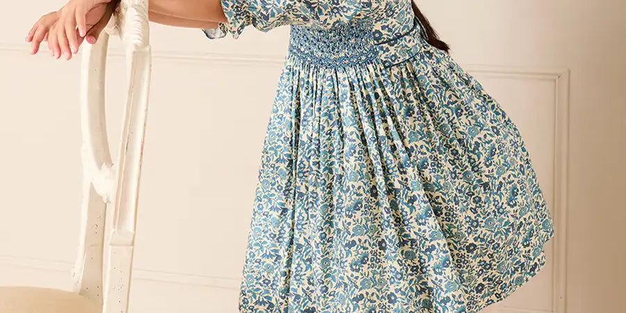 Daphne Floral Hand Smocked Frill Collar Long Sleeve Dress in Blue (18mths-10yrs) Dresses from Pepa London