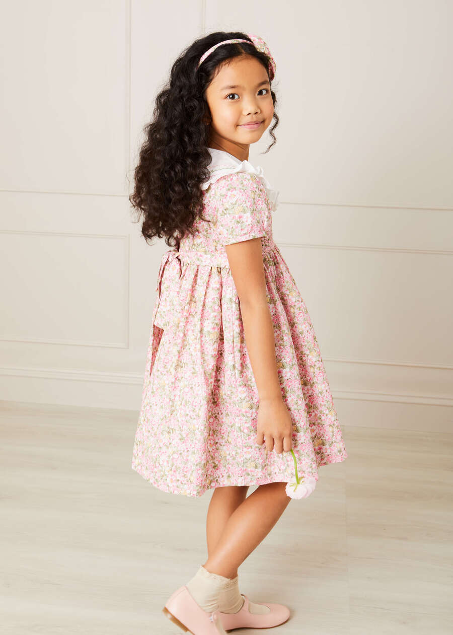 Eloise Floral Print Hand Smocked Short Sleeve Dress in Pink (12mths-10yrs) Dresses  from Pepa London