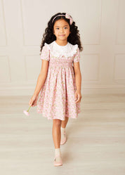 Eloise Floral Print Hand Smocked Short Sleeve Dress in Pink (12mths-10yrs) Dresses  from Pepa London