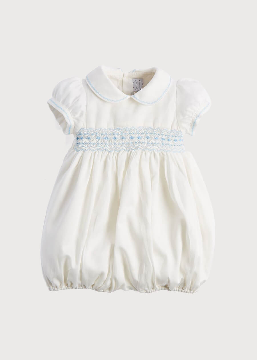 Classic Off-White Blue Hand Smocked Romper (3-18mths) Rompers  from Pepa London