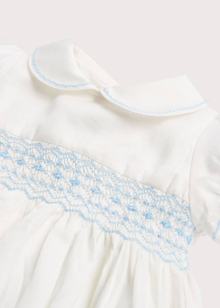 Classic Off-White Blue Hand Smocked Romper (3-18mths) Rompers  from Pepa London